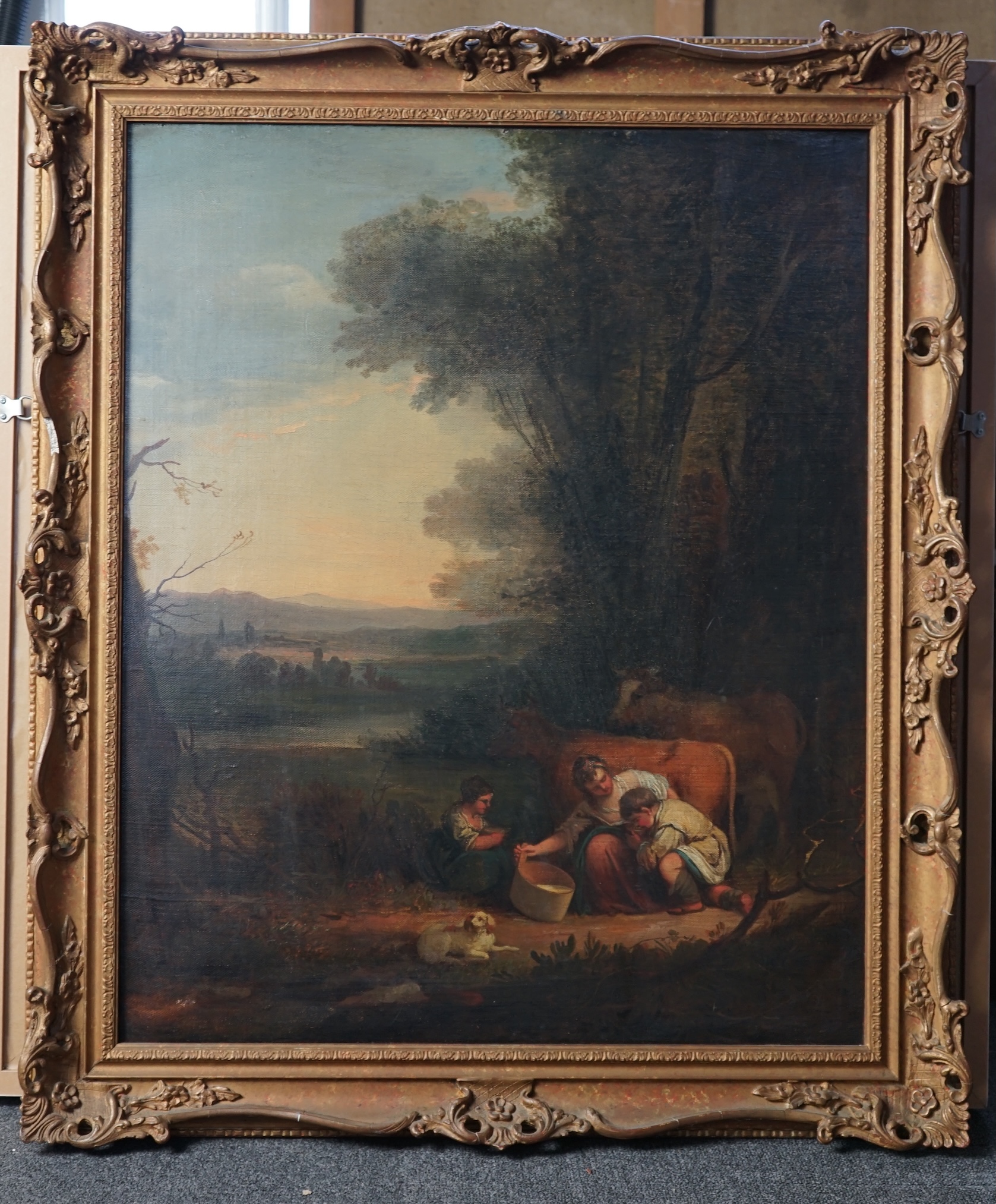 Attributed to Thomas Barker of Bath (British, 1769-1847), oil on canvas, Landscape with figures milking a cow, 75 x 61.5cm. Condition - fair to good, losses to frame